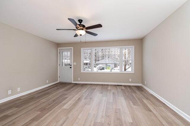 interior space featuring ceiling fan and light wood-type flooring