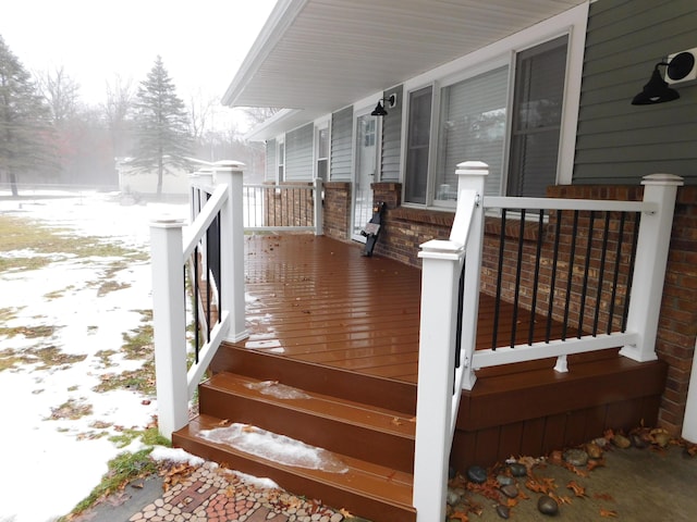 view of snow covered deck