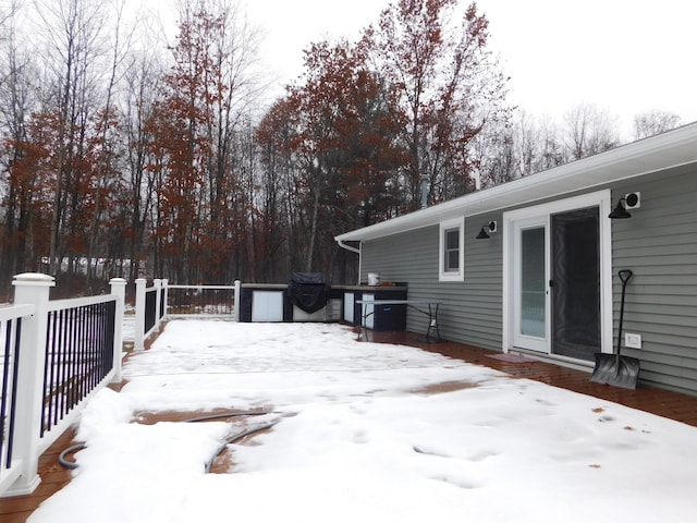 view of snow covered deck