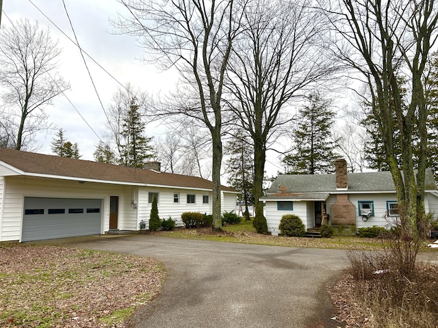 ranch-style house featuring a garage