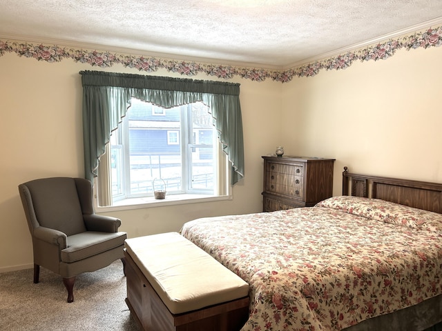 carpeted bedroom featuring a textured ceiling