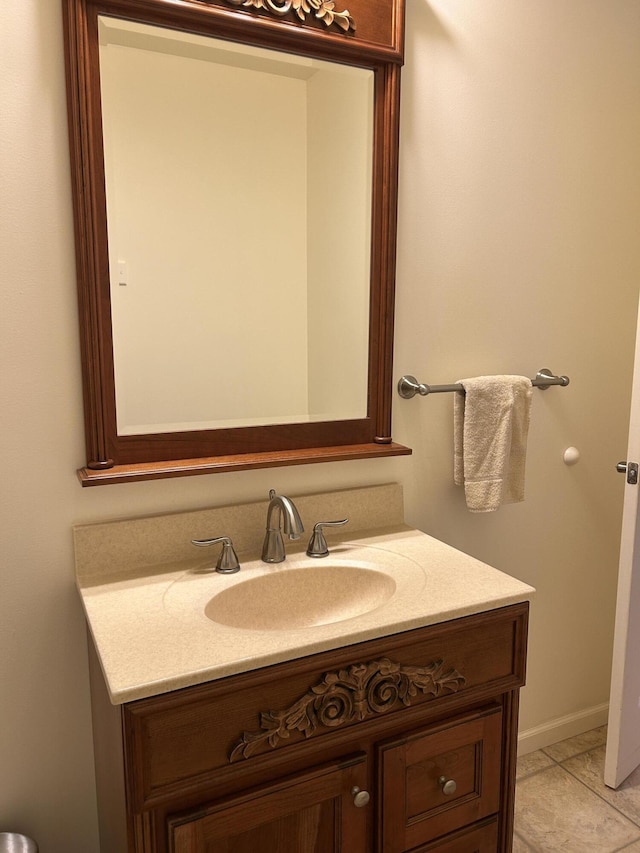 bathroom with tile patterned flooring and vanity