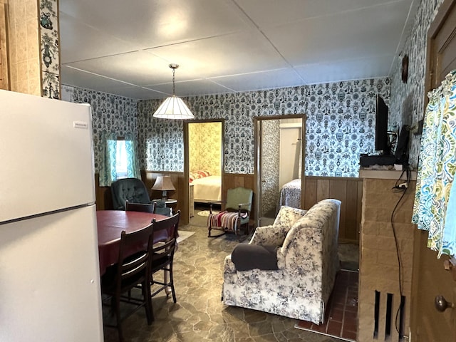 living room featuring wood walls