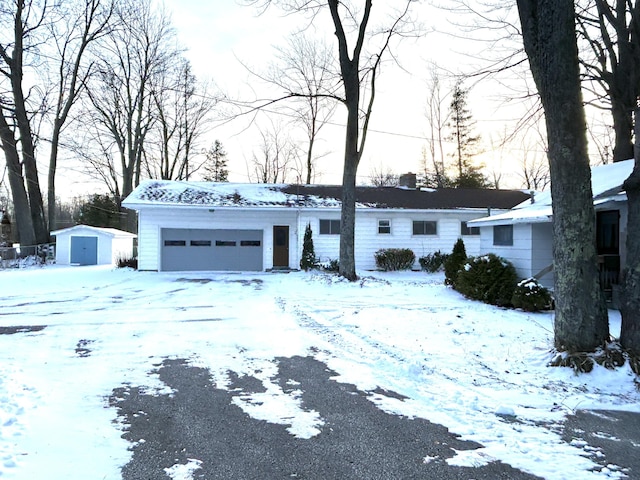 view of front of home featuring a storage shed