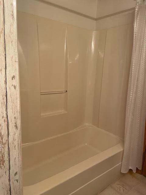 bathroom featuring tile patterned floors and shower / bath combination with curtain