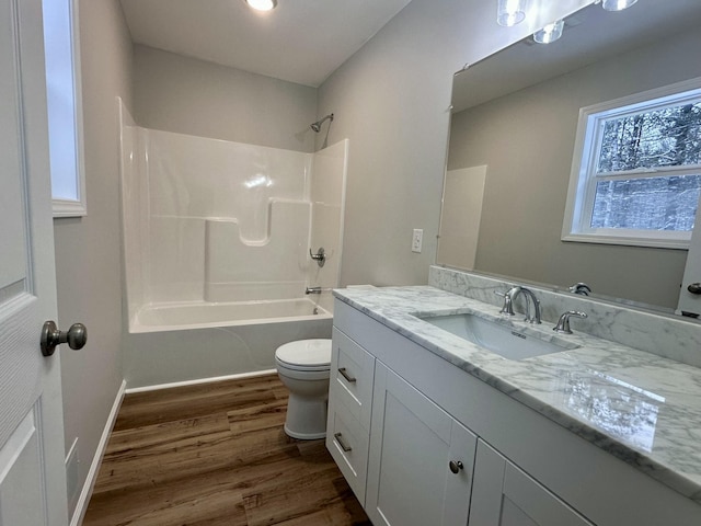 full bathroom with shower / bath combination, toilet, vanity, and hardwood / wood-style flooring