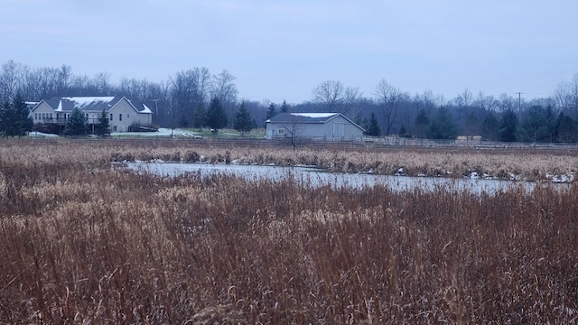 view of yard with a rural view