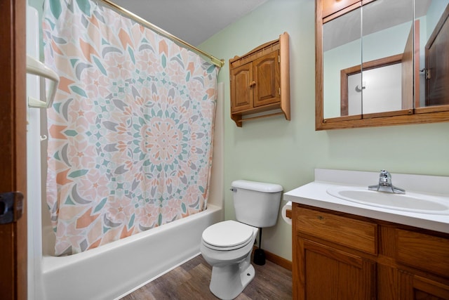 full bathroom featuring hardwood / wood-style floors, vanity, toilet, and shower / bath combo with shower curtain