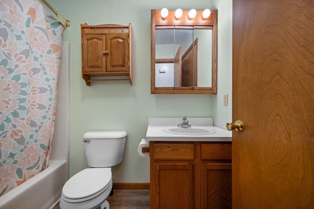 full bathroom featuring shower / bath combination with curtain, vanity, and toilet