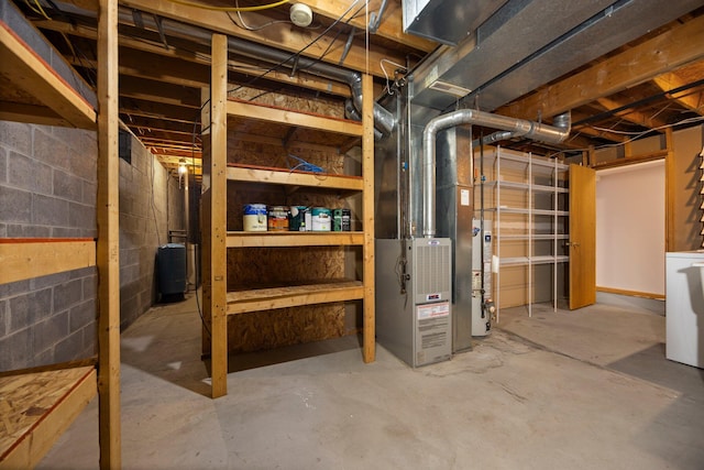 basement with gas water heater and washer / clothes dryer