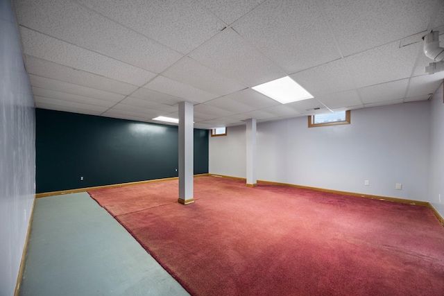 basement featuring a drop ceiling