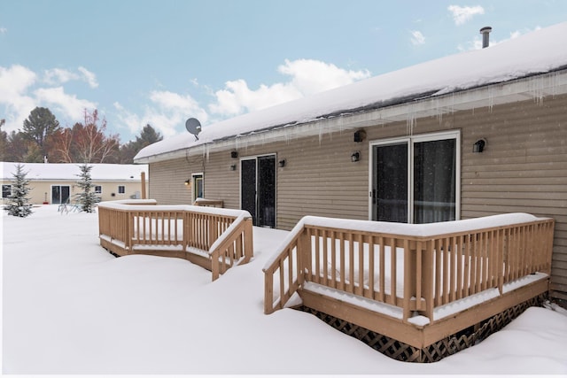 view of snow covered deck