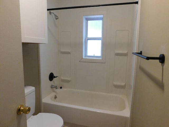 bathroom with toilet and shower / washtub combination