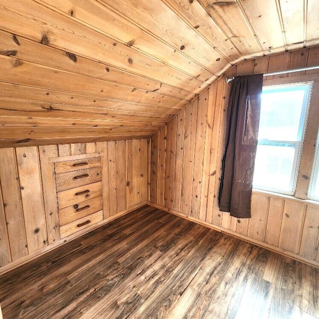 additional living space with wooden walls, lofted ceiling, dark hardwood / wood-style floors, and wooden ceiling