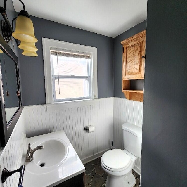 bathroom with tile patterned floors, vanity, and toilet