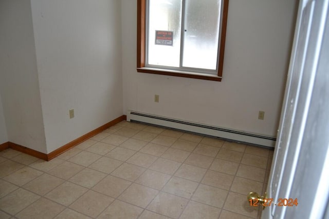 spare room featuring a baseboard radiator