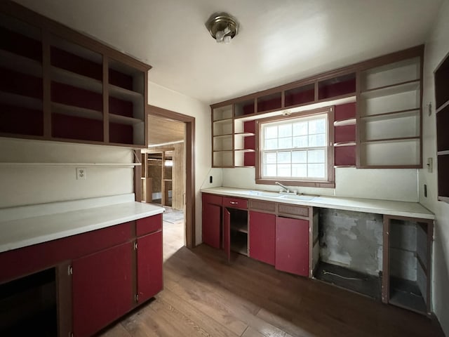 kitchen with light wood-type flooring and sink