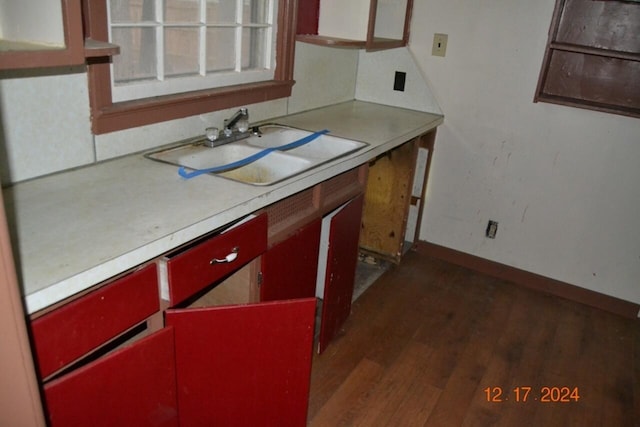 kitchen with sink and dark wood-type flooring