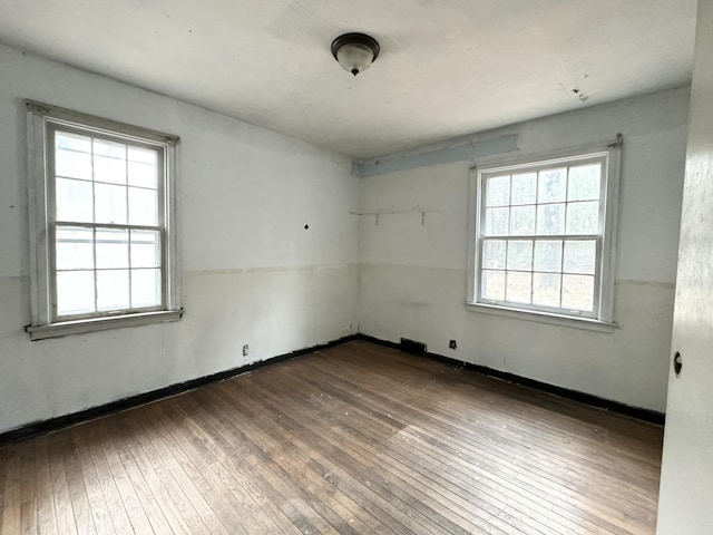 empty room with wood-type flooring