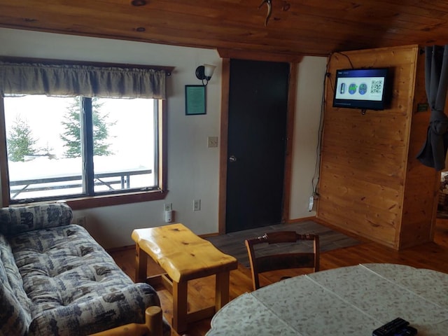 living room with hardwood / wood-style flooring and wood ceiling