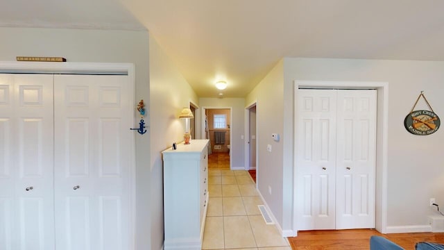 corridor with light tile patterned flooring