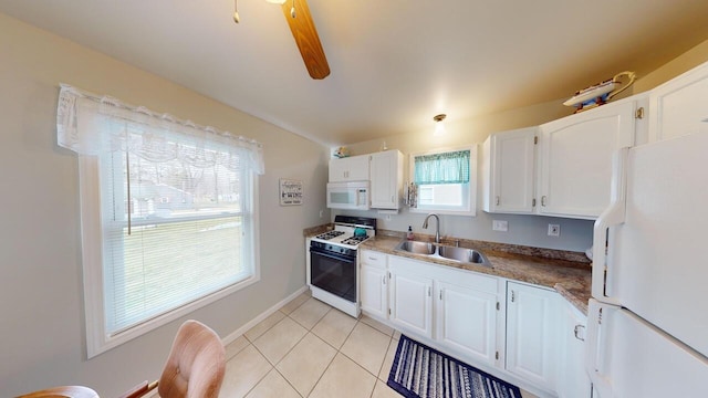 kitchen with sink, white cabinets, and white appliances