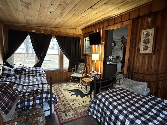 bedroom with wooden walls and wooden ceiling