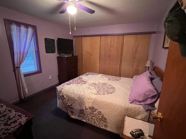 bedroom featuring ceiling fan and a closet