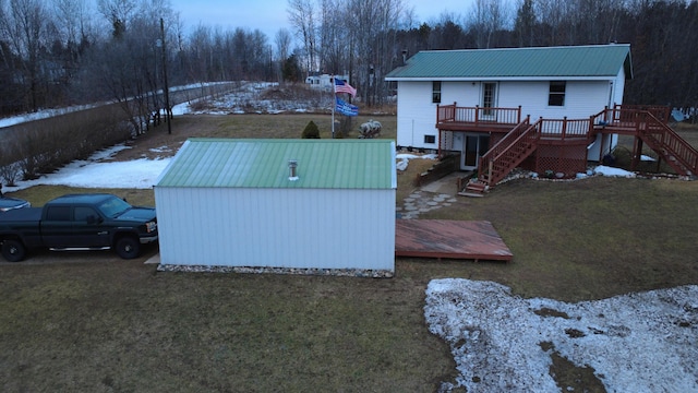 exterior space with a wooden deck and a yard