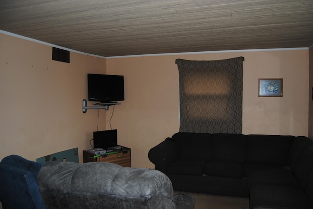 living room with wood ceiling and ornamental molding