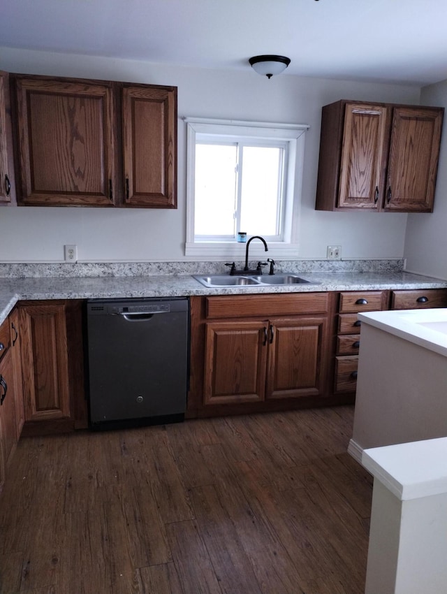 kitchen with dishwasher, dark hardwood / wood-style floors, and sink