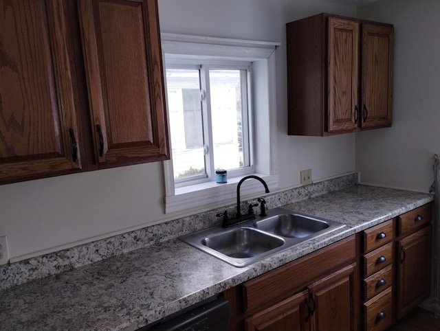 kitchen with dark brown cabinets and sink