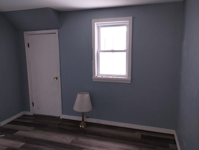 spare room featuring dark hardwood / wood-style floors