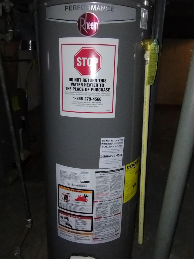 utility room featuring gas water heater