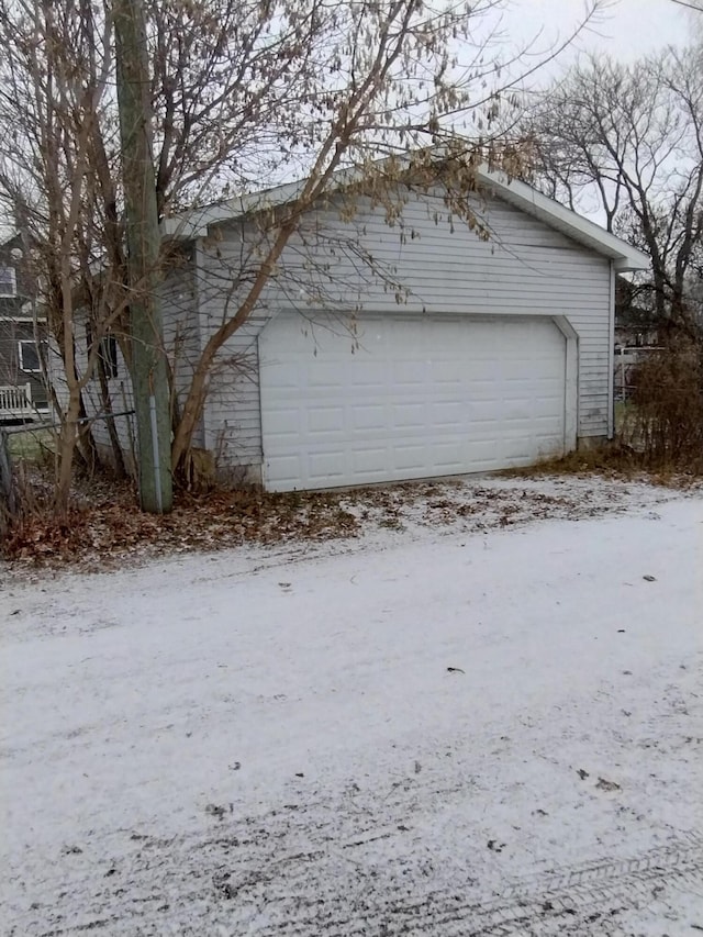 view of snow covered garage