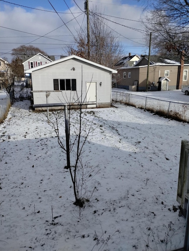 view of yard layered in snow