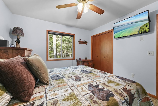 bedroom with ceiling fan and a closet