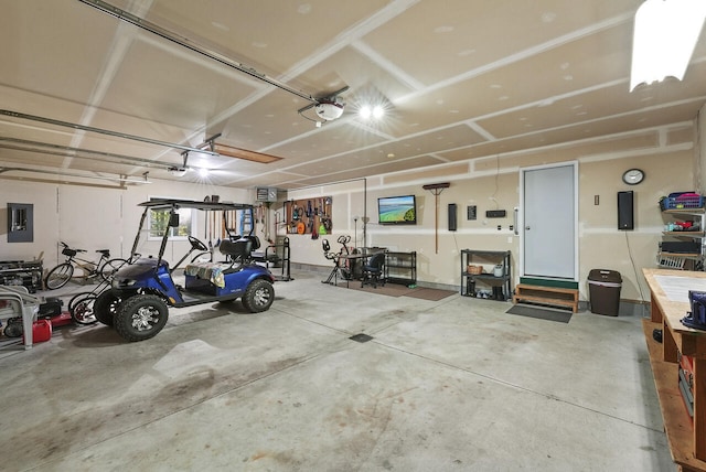 garage with electric panel and a garage door opener