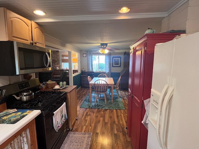 kitchen featuring ceiling fan, black gas stove, hardwood / wood-style floors, and white refrigerator with ice dispenser