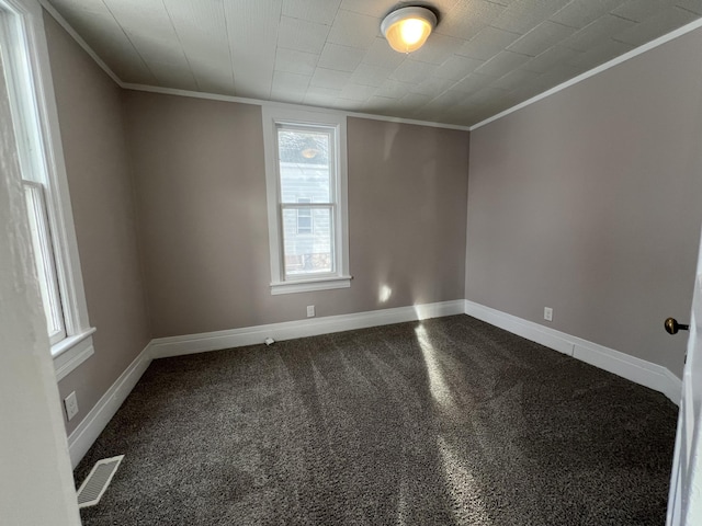 unfurnished room featuring carpet flooring and crown molding