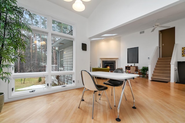 dining room featuring wood-type flooring and ceiling fan