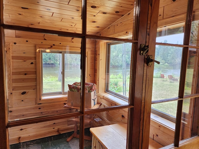 sunroom / solarium featuring wood ceiling and vaulted ceiling