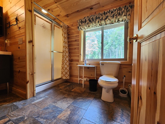 bathroom featuring wood walls, wooden ceiling, lofted ceiling, toilet, and a shower with shower door