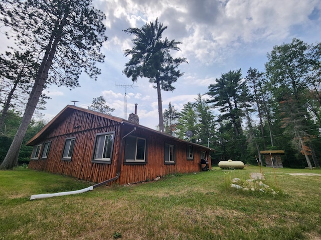 view of property exterior featuring a yard