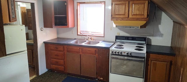 kitchen featuring sink, white refrigerator, and electric stove