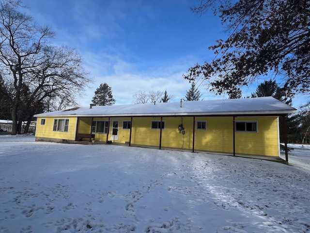 view of snow covered house