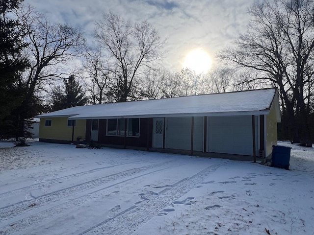 ranch-style house featuring a garage