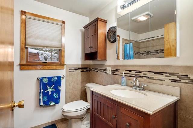 bathroom with vanity, walk in shower, and toilet