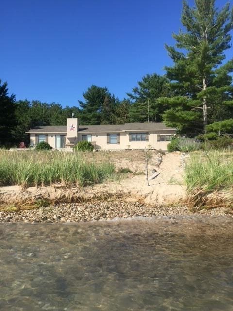 view of front of home featuring a water view