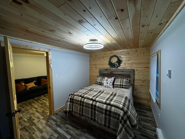 bedroom with dark wood-type flooring, wooden ceiling, and wood walls